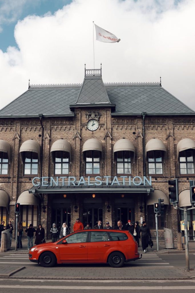 Street view of Gothenburg Central Station with people and traffic in Sweden.