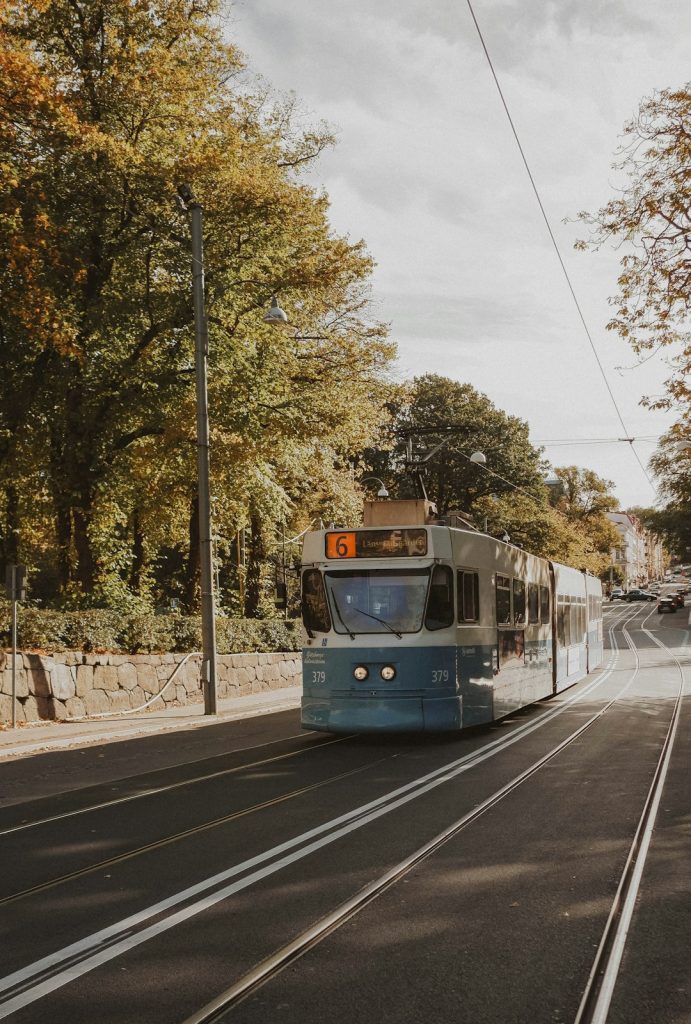 green-and-yellow-train-on-rail-road-during-daytime-llpyvbwtrwq
